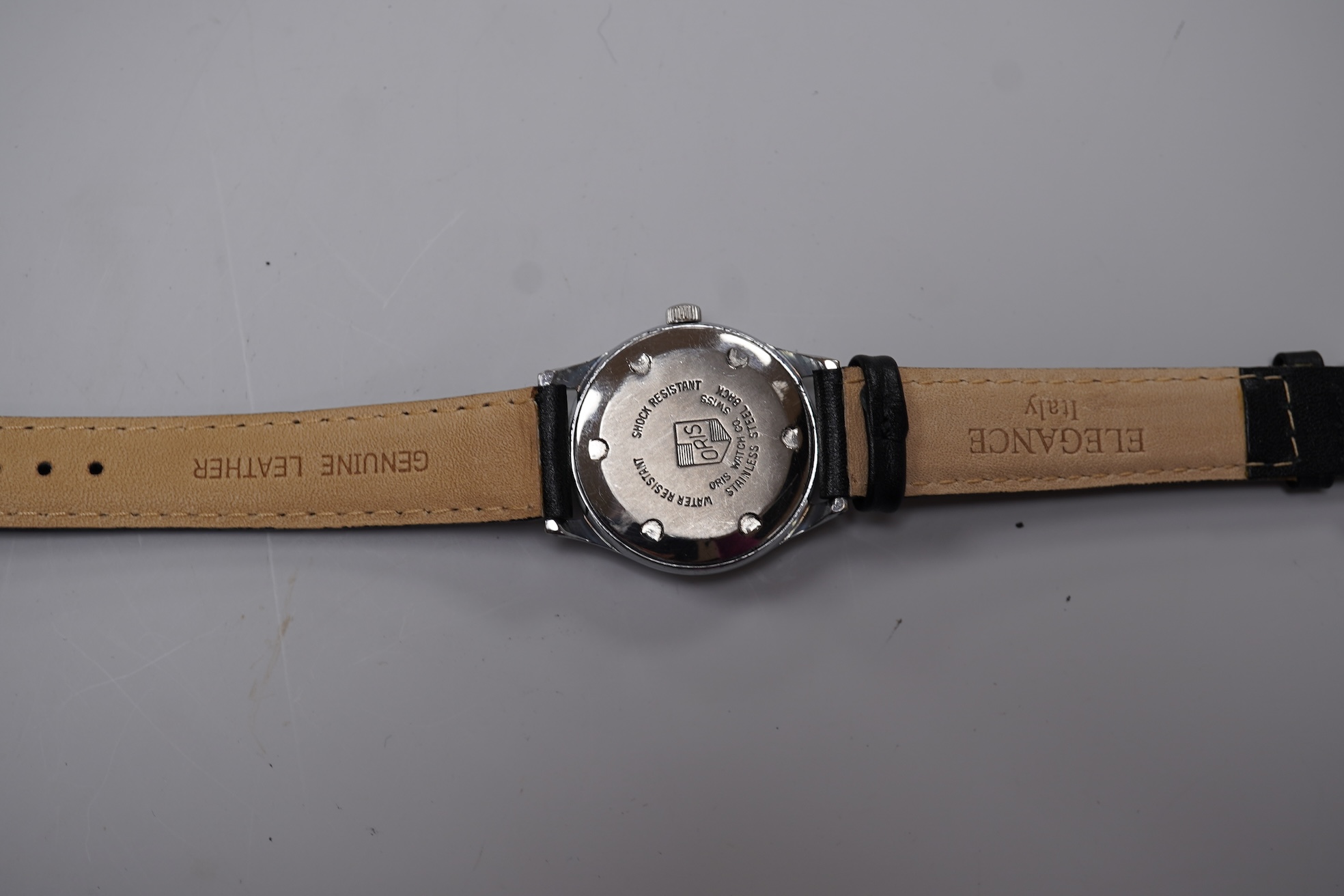 A gentleman's stainless steel backed Oris manual wind calendar wrist watch, with black Arabic dial, subsidiary seconds and date indicator hand, case diameter 32mm, on an associated leather strap, no box or papers.